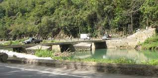 One woman dies after minibus plunges into Rio Cobre