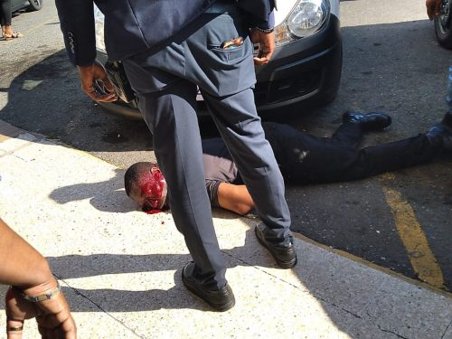 30 M ROBBERY IN PORTMORE: Two security guards gunned down at Portmore Pines Plaza in Brinks robbery